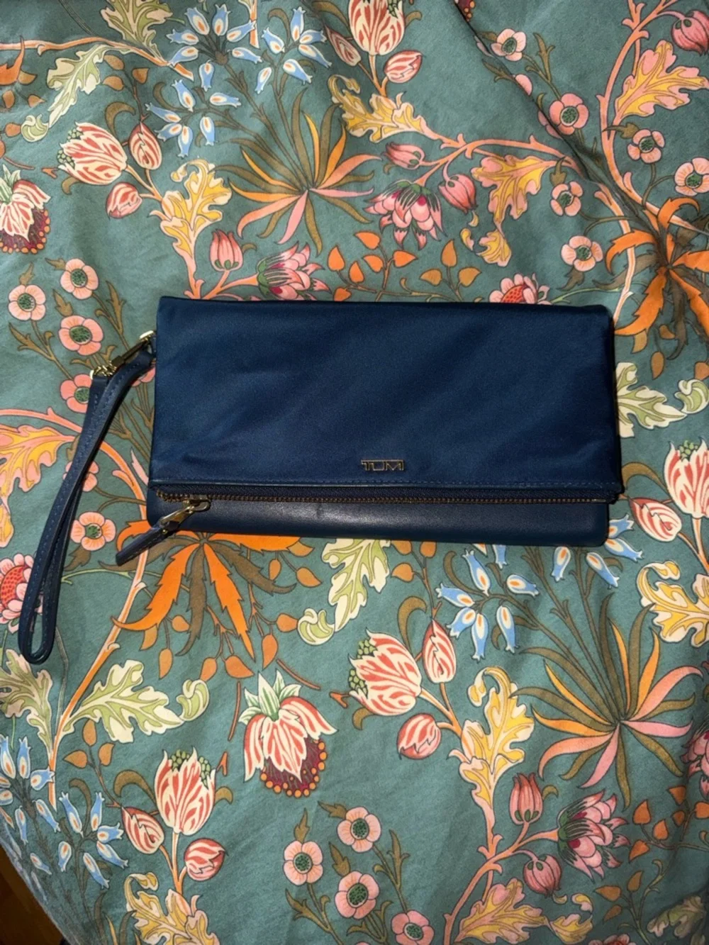 Tumi Navy Fold-Over Wristlet Clutch with Gold Hardware
